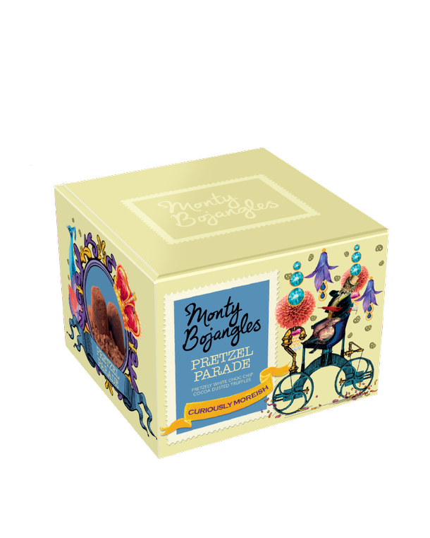 Op de foto staat een lichtgeel doosje met Monty Bojangles chocoladetruffels in de smaak Pretzel Parade.