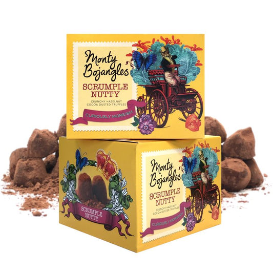 De afbeelding laat twee gele doosjes met Monty Bojangles zien. De Monty Bojangles chocoladetruffels zijn in de smaak Scrumple Nutty.